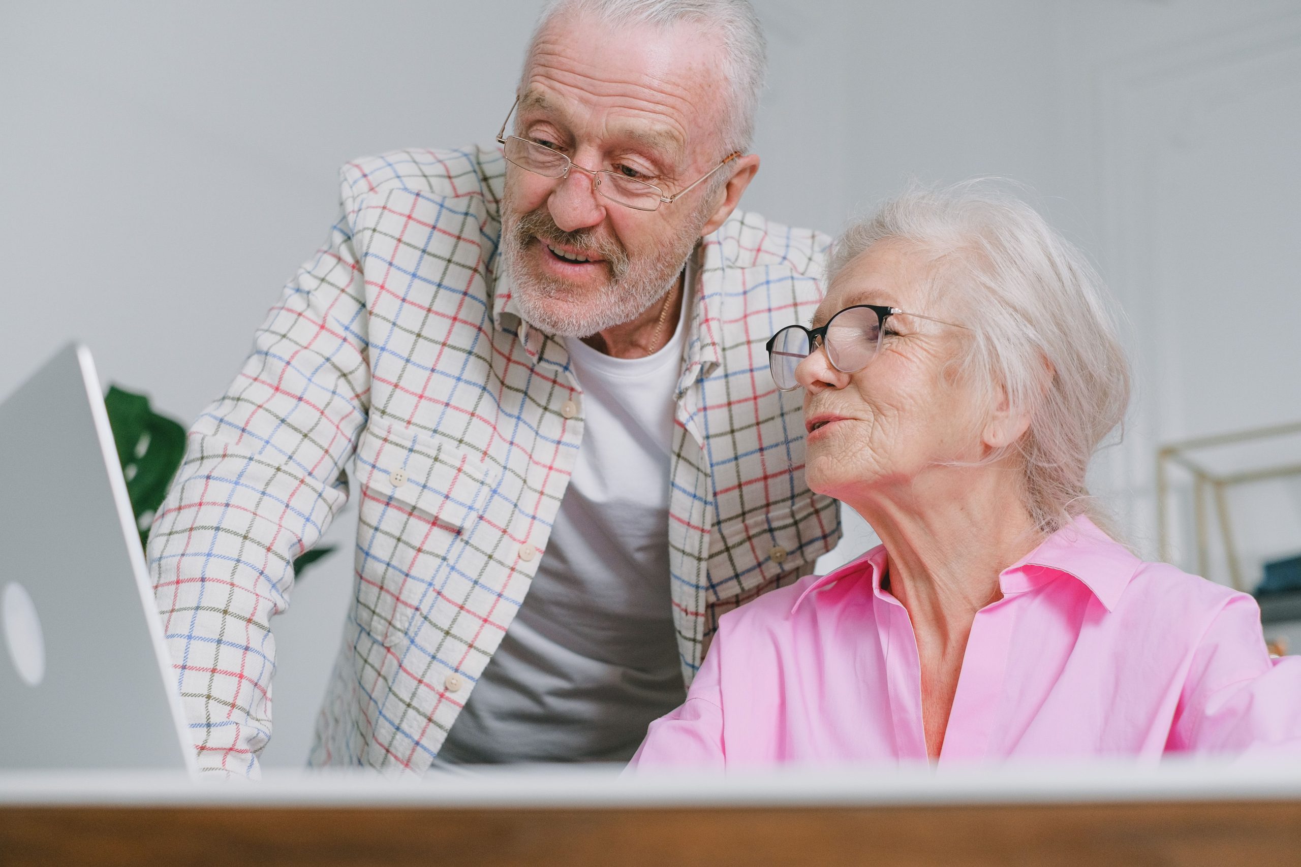 seniors looking at a computer